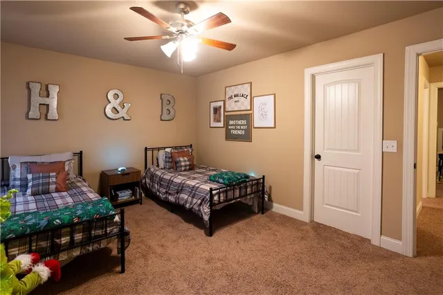 a bedroom with furniture and a baby crib