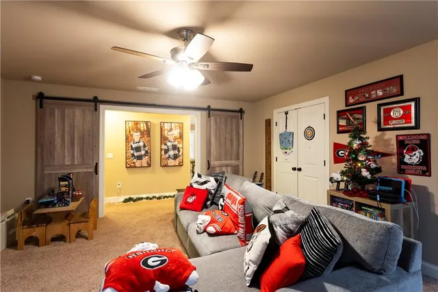 a bedroom with furniture and a large window