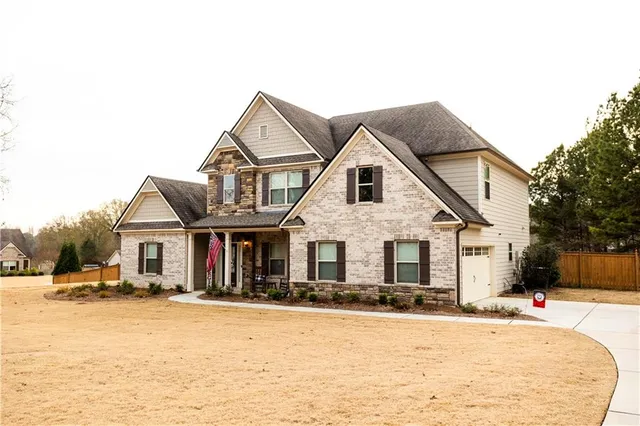 a front view of a house with a yard