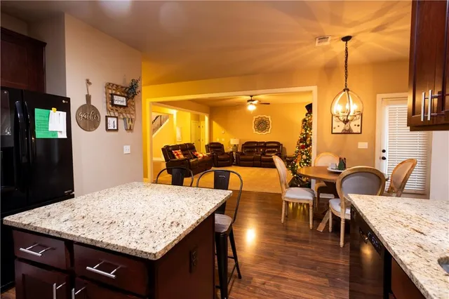 a dining table with chairs and wooden floor