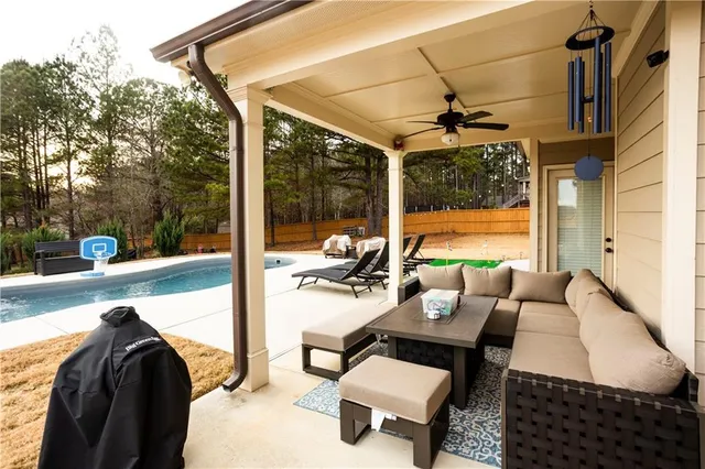 a balcony view with a couch and wooden floor