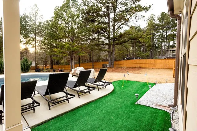 a view of a sitting area with furniture and garden