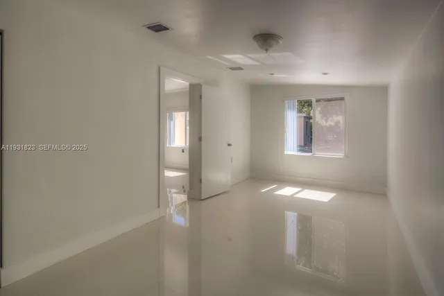 a view of a house with yard and a garden