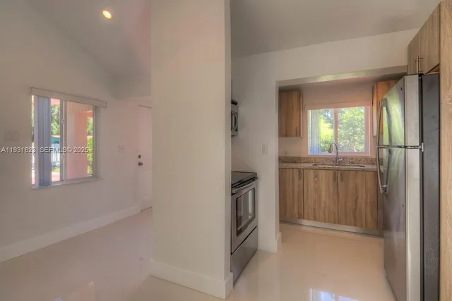 a view of hallway with windows