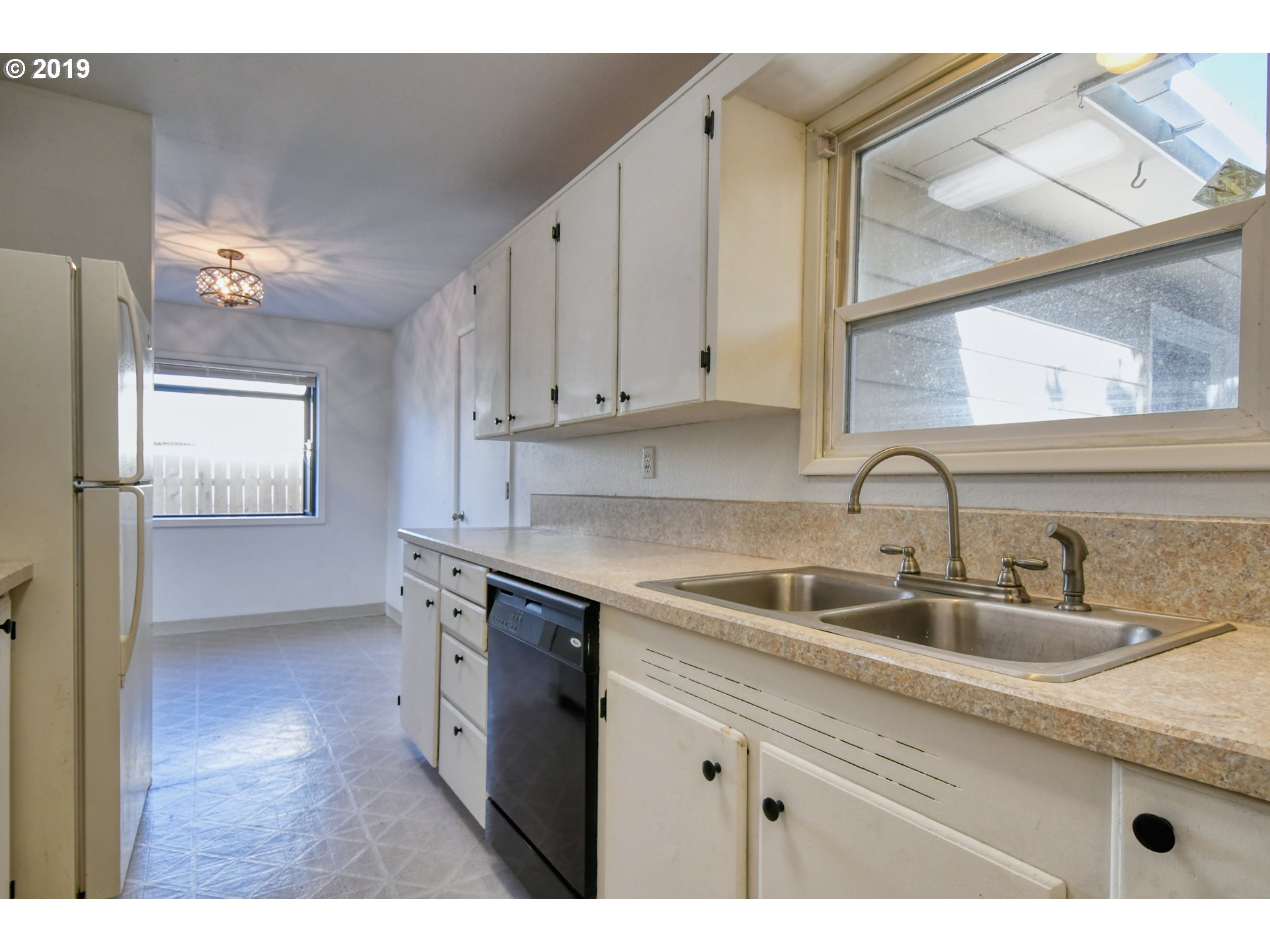 2406 Southwest Olson Avenue Pendleton, OR 97801 - Photo 11 of 32 a kitchen with a sink cabinets and window