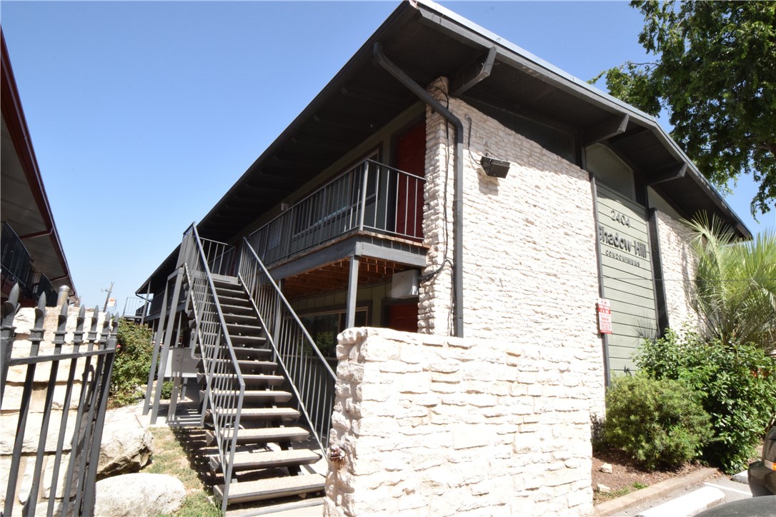 2404 Longview Street, Unit 103 Austin, TX 78705 - Photo 1 of 12 a view of wooden house with a door and wooden floor