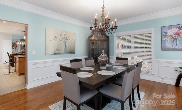 a living room with furniture and white walls