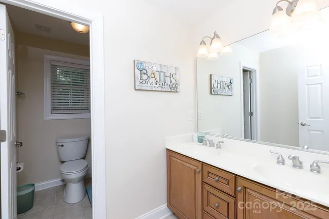 a bathroom with a white tub shower