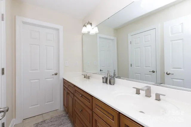 a view of backyard with deck and outdoor seating