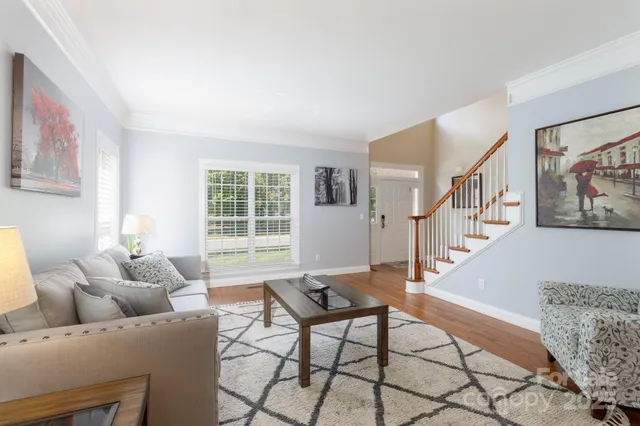 a kitchen with stainless steel appliances kitchen island granite countertop a sink and cabinets