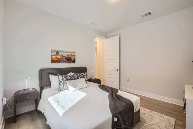 a bedroom with a bed and furniture