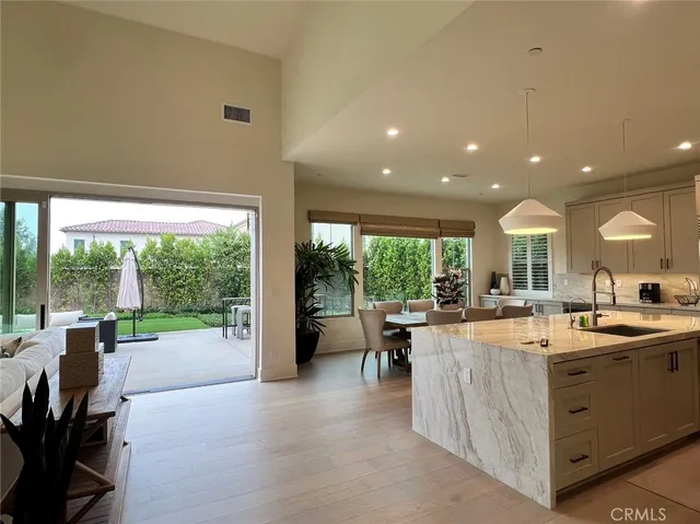 a view of a kitchen with kitchen island a large window in it