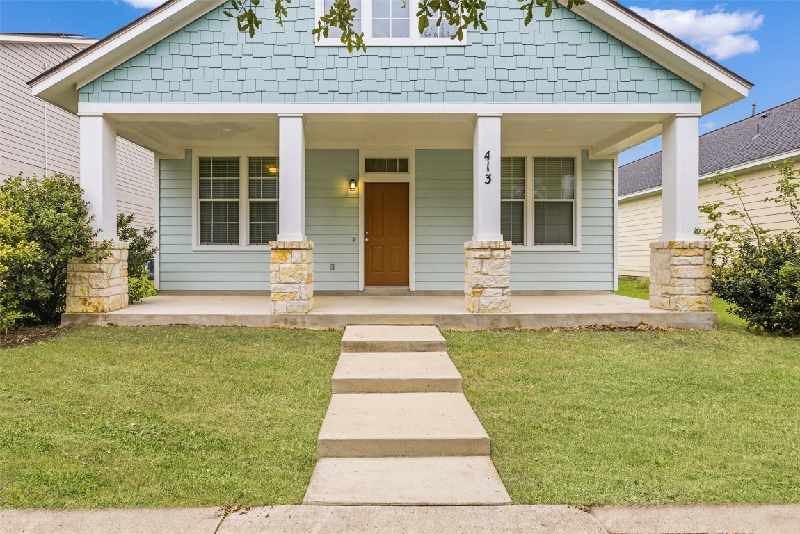 413 Shadow Point San Marcos, TX 78666 - Photo 2 of 34 The front door perfectly contrasts the exterior facade.