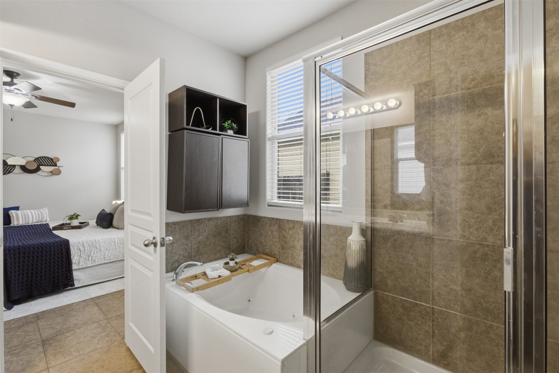 413 Shadow Point San Marcos, TX 78666 - Photo 23 of 34 Enjoy relaxation in your jetted tub, while a separate walk-in shower is also available.