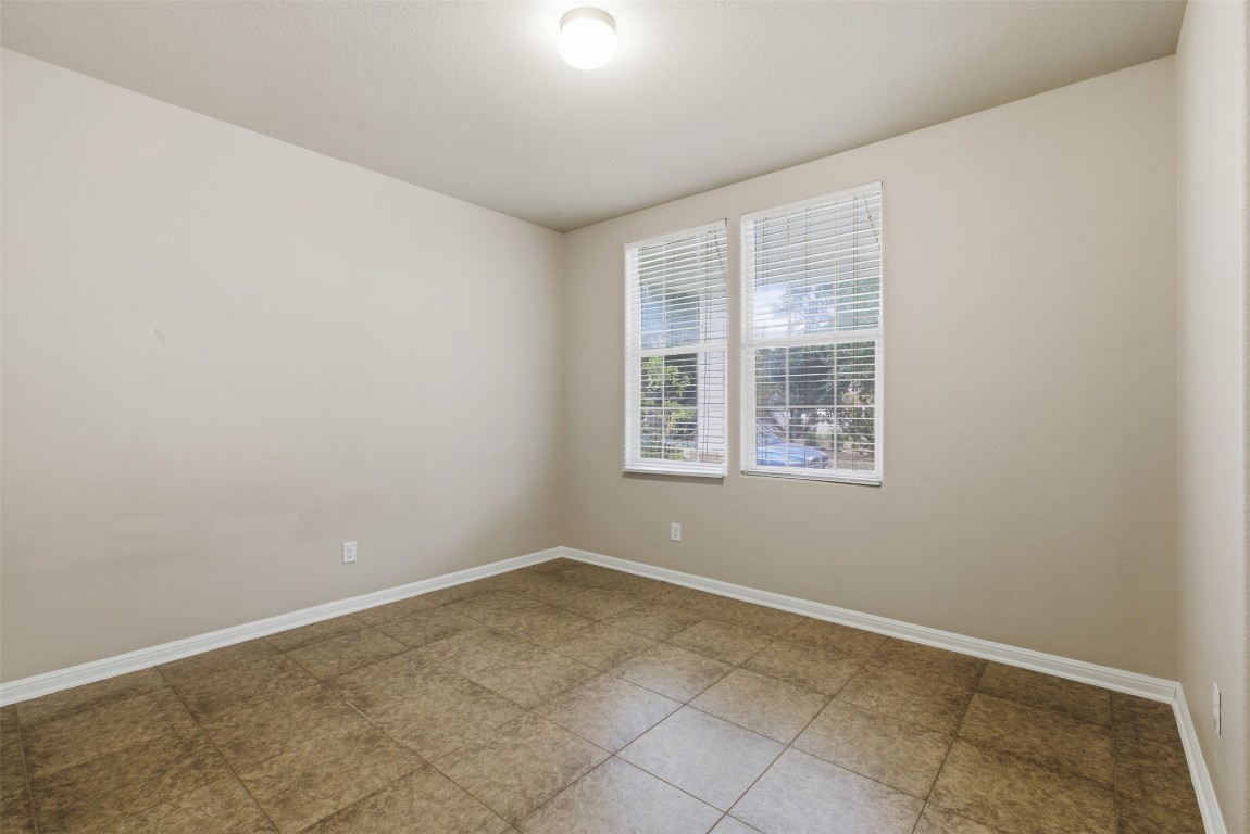 413 Shadow Point San Marcos, TX 78666 - Photo 24 of 34 Two secondary bedrooms are available at the front of the home.