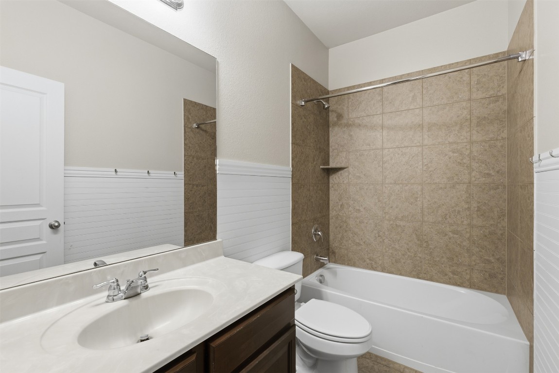 413 Shadow Point San Marcos, TX 78666 - Photo 25 of 34 The bedrooms are separated by a secondary full bath.