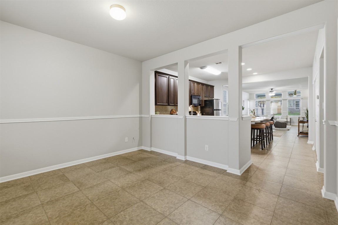 413 Shadow Point San Marcos, TX 78666 - Photo 5 of 34 Set at the entry with quick access to the kitchen, this space could be used as formal living or dining.