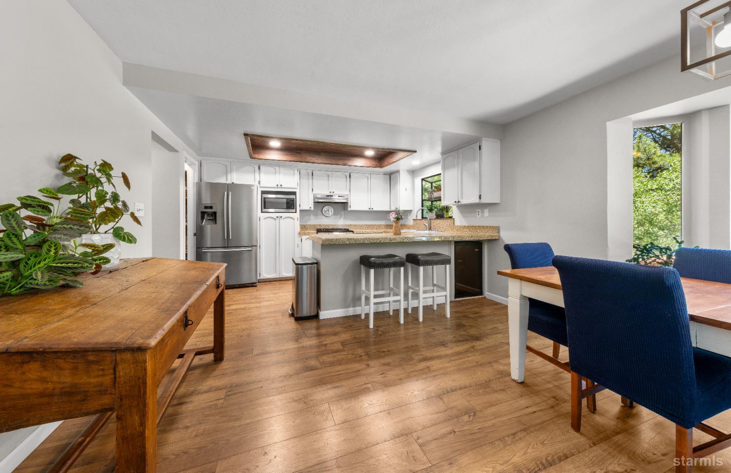 1121 Sundown Trail South Lake Tahoe, CA 96150 - Photo 11 of 40 a view of a dining room with furniture window and wooden floor