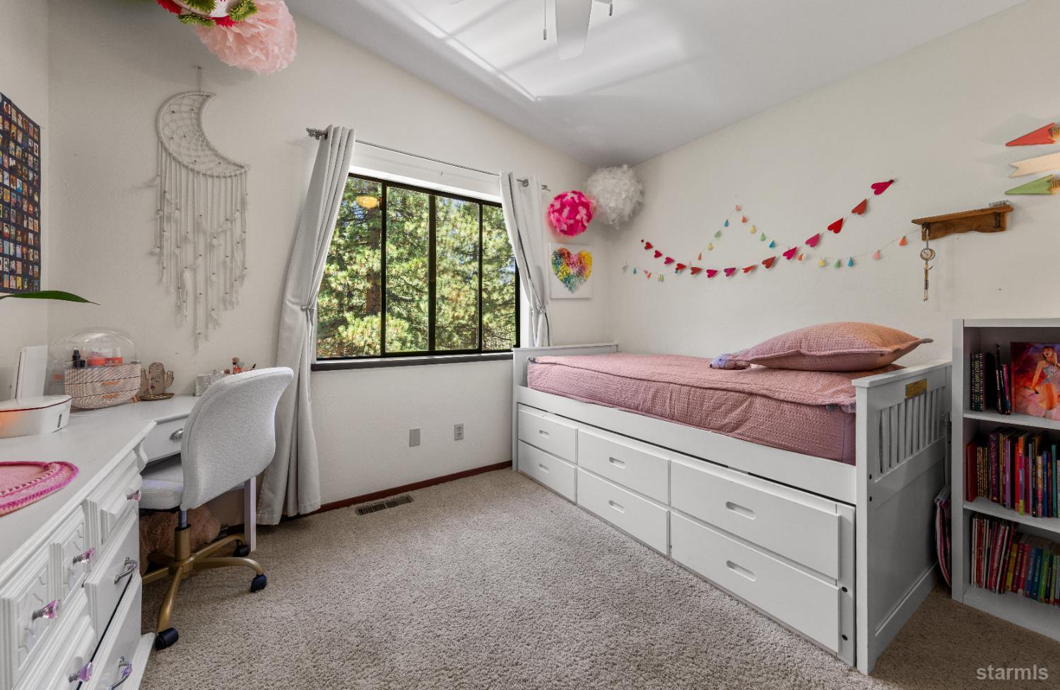 1121 Sundown Trail South Lake Tahoe, CA 96150 - Photo 21 of 40 a room with a window and a dresser in it