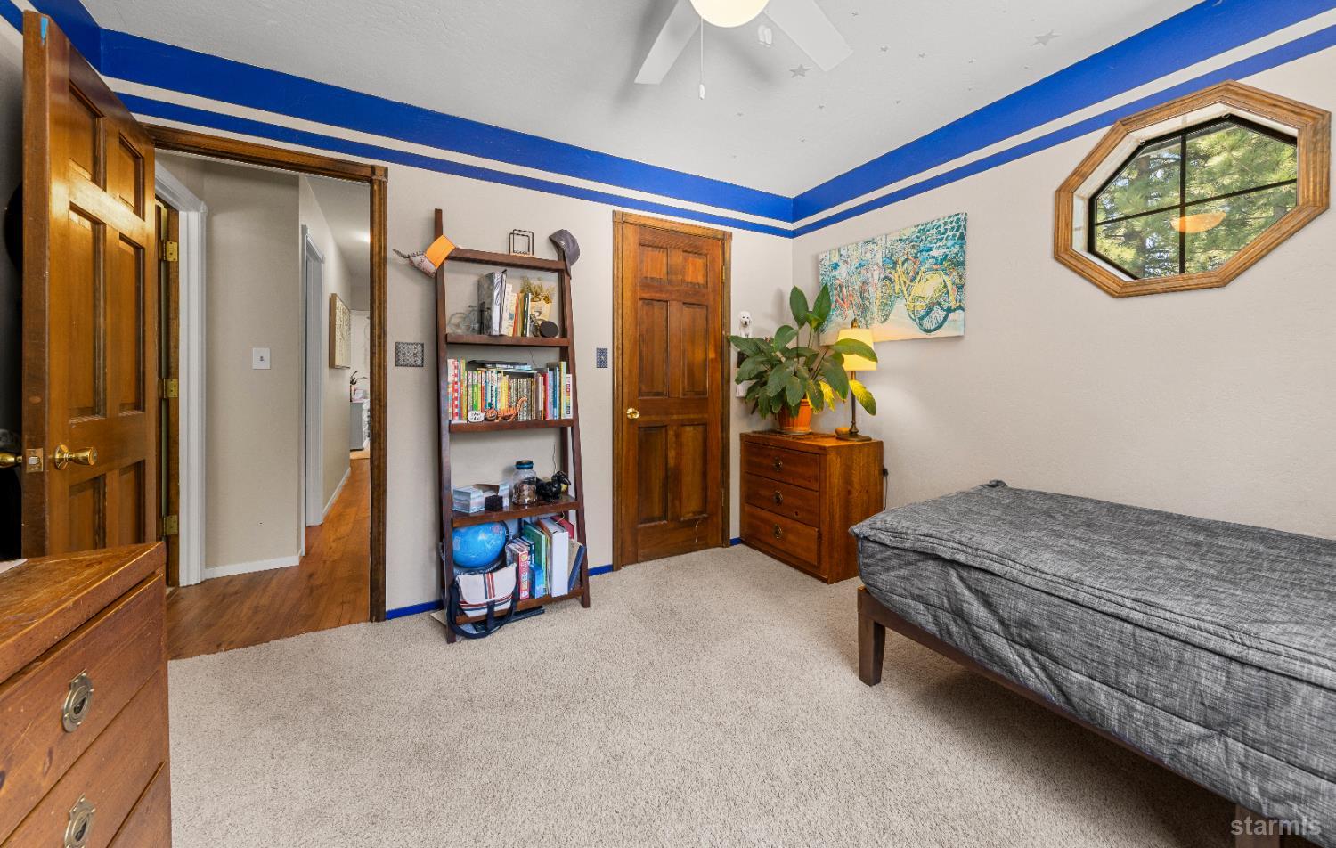 1121 Sundown Trail South Lake Tahoe, CA 96150 - Photo 23 of 40 a bedroom with furniture and a large window