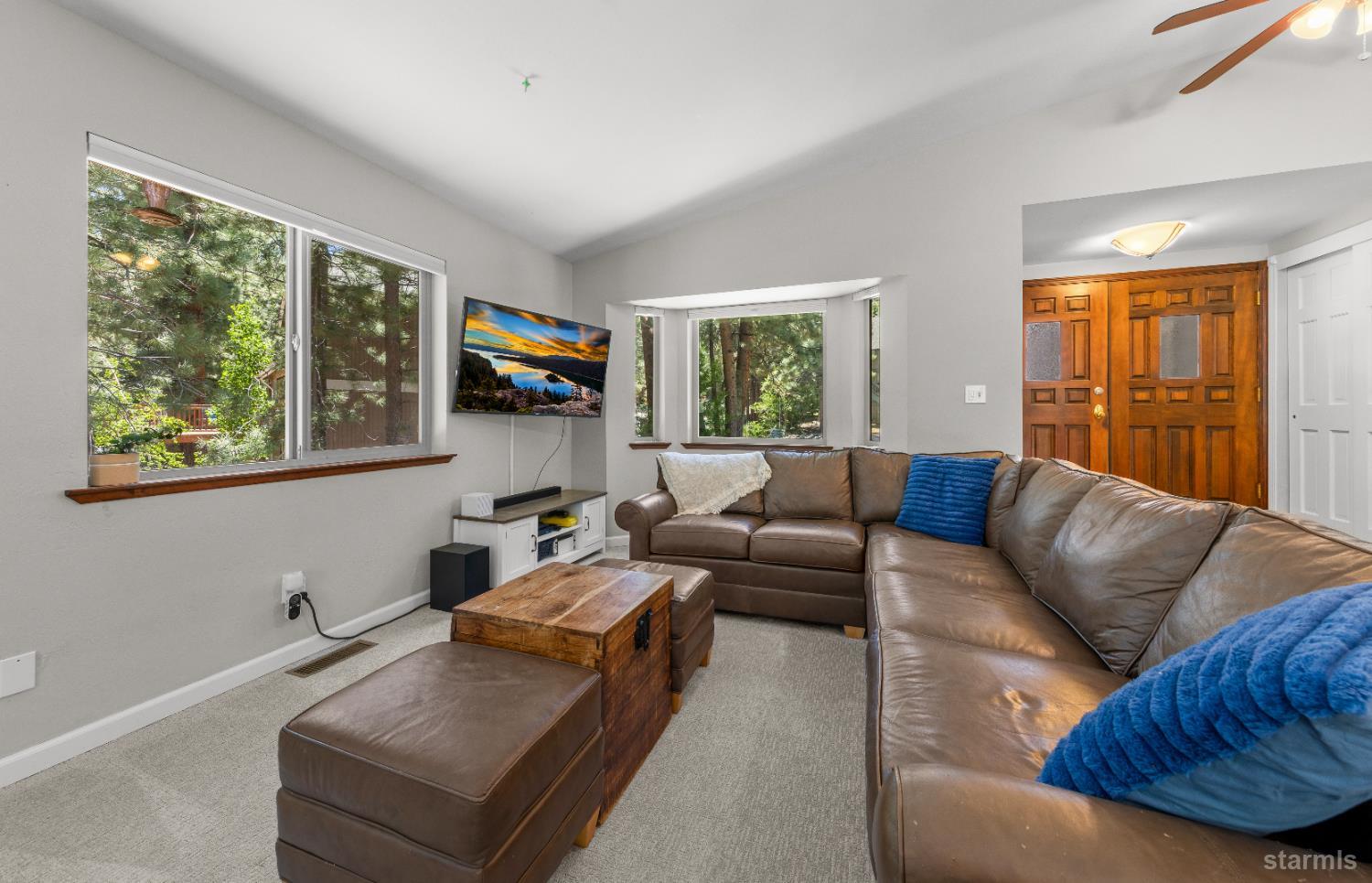 1121 Sundown Trail South Lake Tahoe, CA 96150 - Photo 7 of 40 a living room with furniture and a flat screen tv