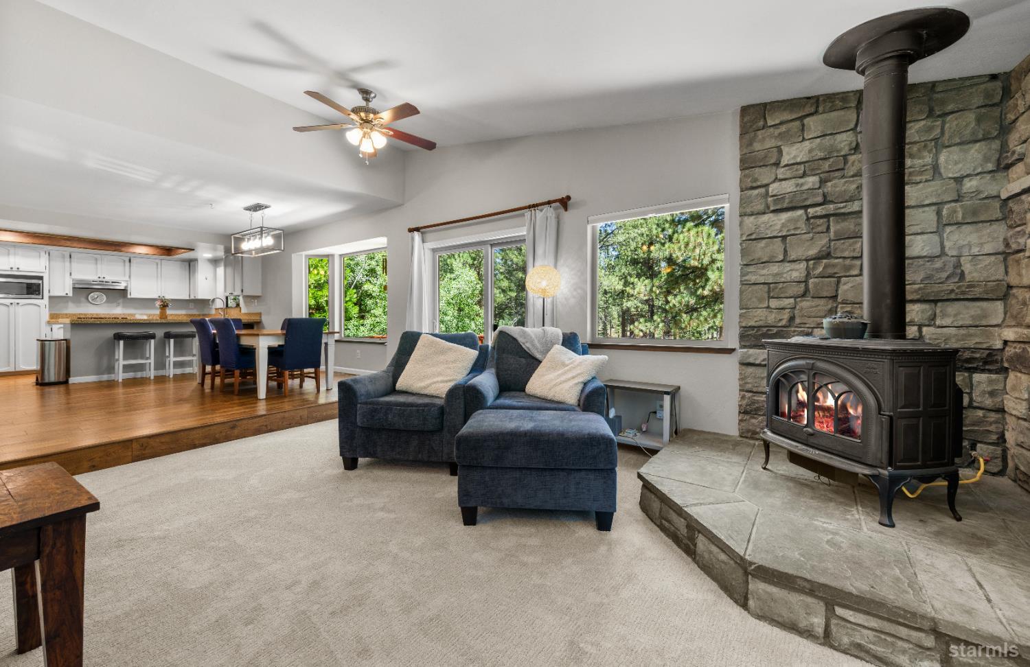 1121 Sundown Trail South Lake Tahoe, CA 96150 - Photo 8 of 40 a living room with furniture and a fireplace