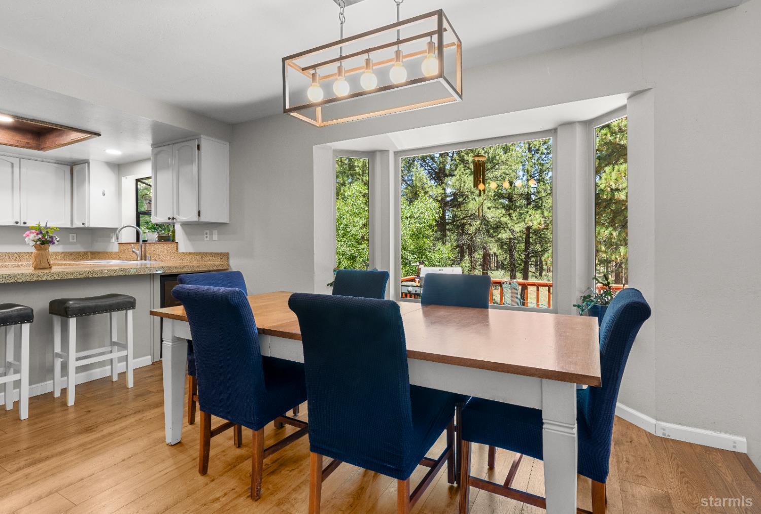 1121 Sundown Trail South Lake Tahoe, CA 96150 - Photo 10 of 40 a view of a dining room with furniture window and wooden floor