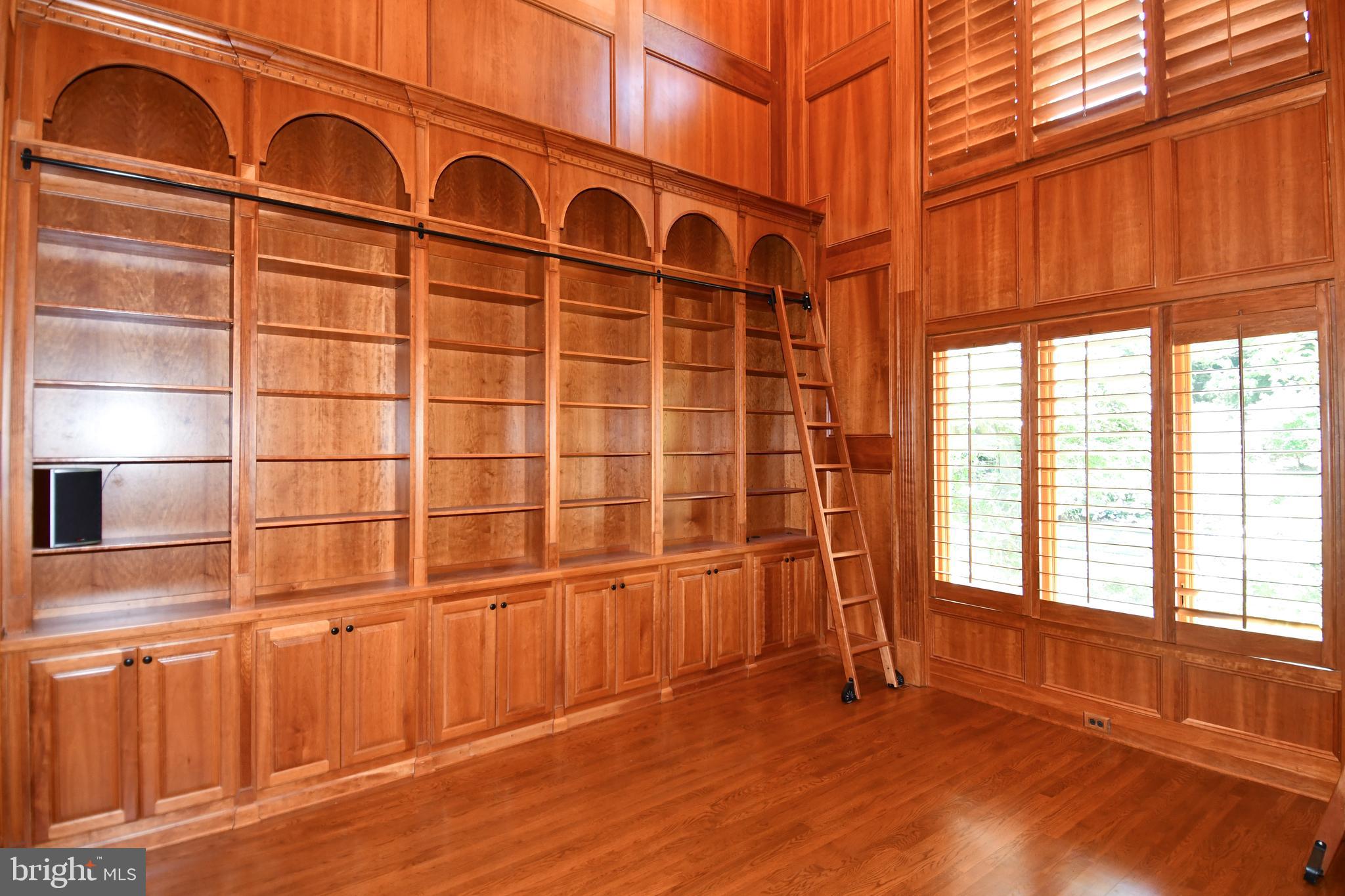7808 Southdown Road Alexandria, VA 22308 - Photo 50 of 99 a view of a livingroom with wooden floor and a window