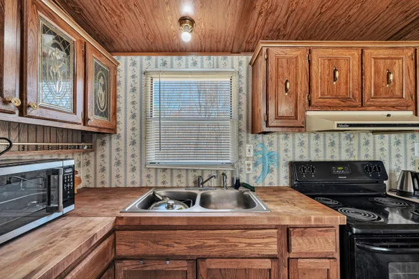 a kitchen that has a sink and a stove