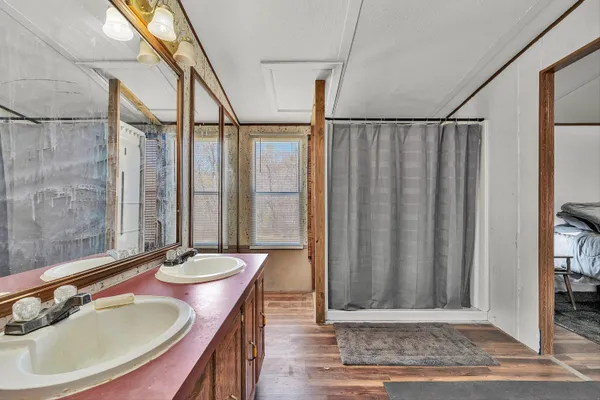 a bathroom with a sink and a mirror