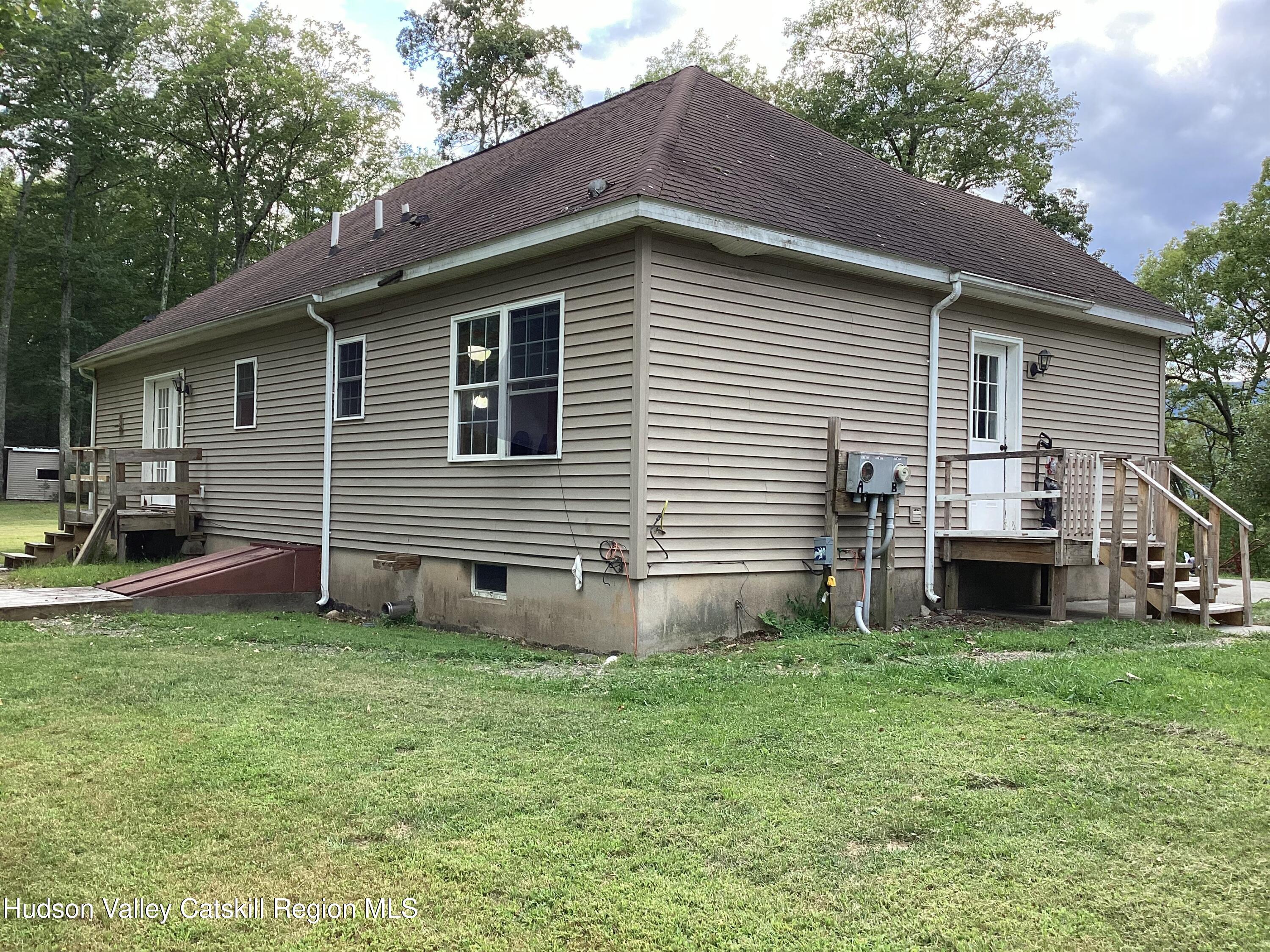 83 Buffalo Road Saugerties, NY 12477 - Photo 36 of 54 a view of a house with a yard and a garden