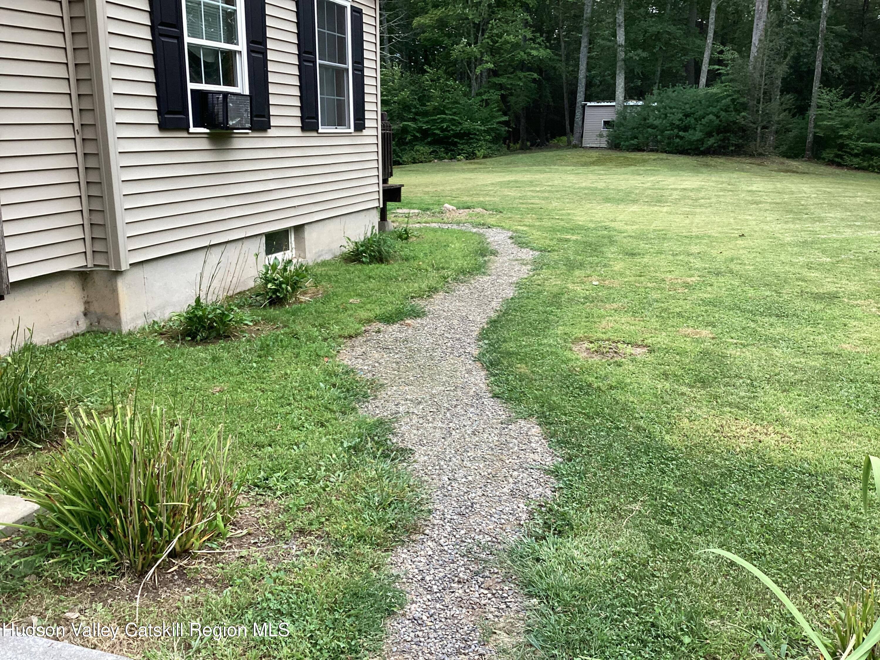 83 Buffalo Road Saugerties, NY 12477 - Photo 38 of 54 a view of a backyard with plants and large trees