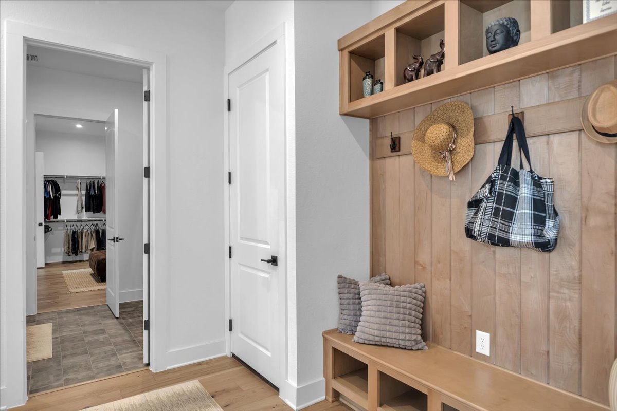 2312 Mondello Path Leander, TX 78641 - Photo 12 of 40 Mudroom with light wood-style flooring and baseboards