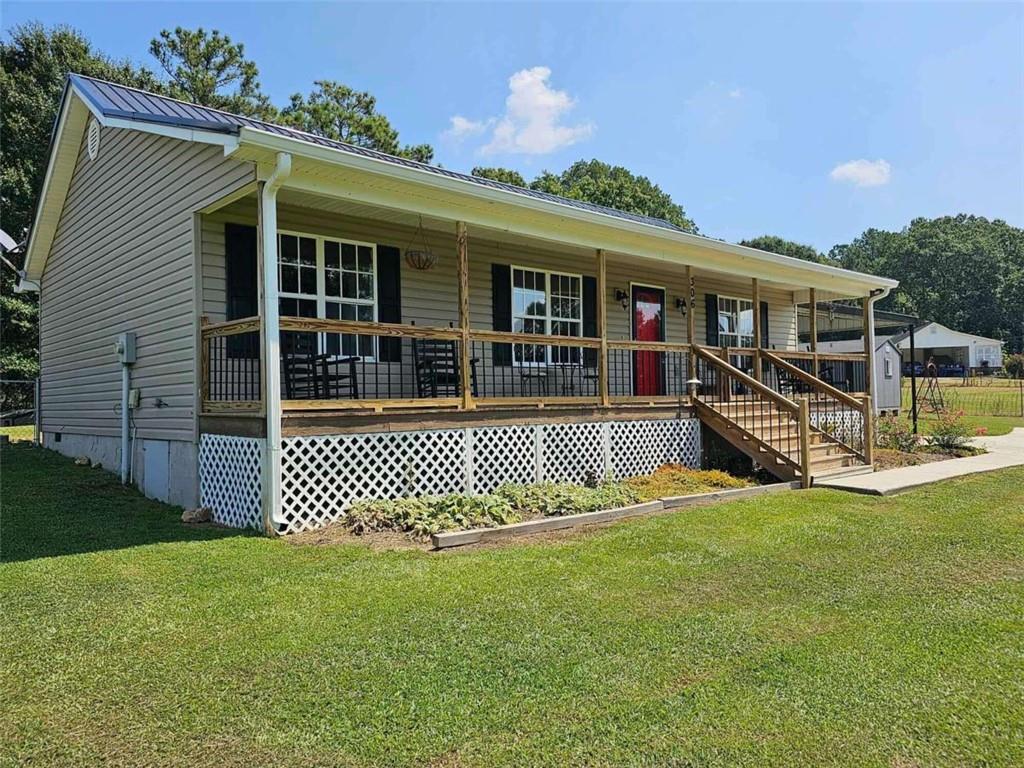 306 Parrish Road Cedartown, GA 30125 - Photo 1 of 1 a front view of a house with a yard