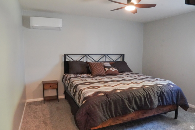 324 Stringtown Road Georgetown, ID 83239 - Photo 17 of 49 Carpeted bedroom featuring a wall mounted air conditioner and ceiling fan