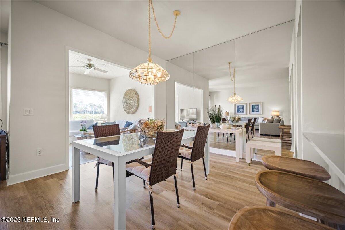 25 Tifton Way South Ponte Vedra Beach, FL 32082 - Photo 13 of 59 a view of a dining room with furniture and wooden floor