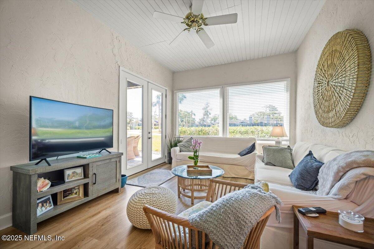 25 Tifton Way South Ponte Vedra Beach, FL 32082 - Photo 16 of 59 a living room with furniture and a flat screen tv