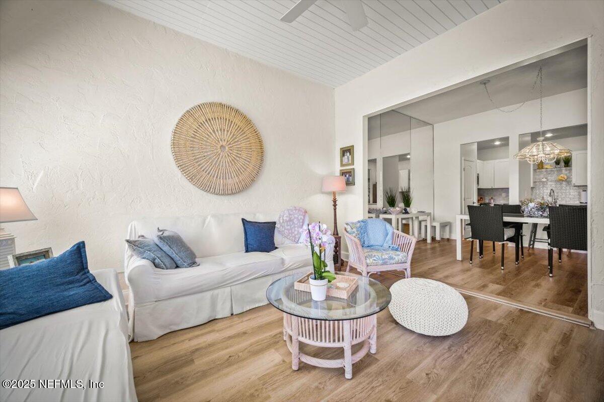 25 Tifton Way South Ponte Vedra Beach, FL 32082 - Photo 18 of 59 a living room with furniture a wooden floor and kitchen