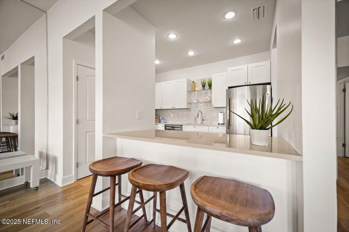 25 Tifton Way South Ponte Vedra Beach, FL 32082 - Photo 19 of 59 a kitchen with a table and chairs in it