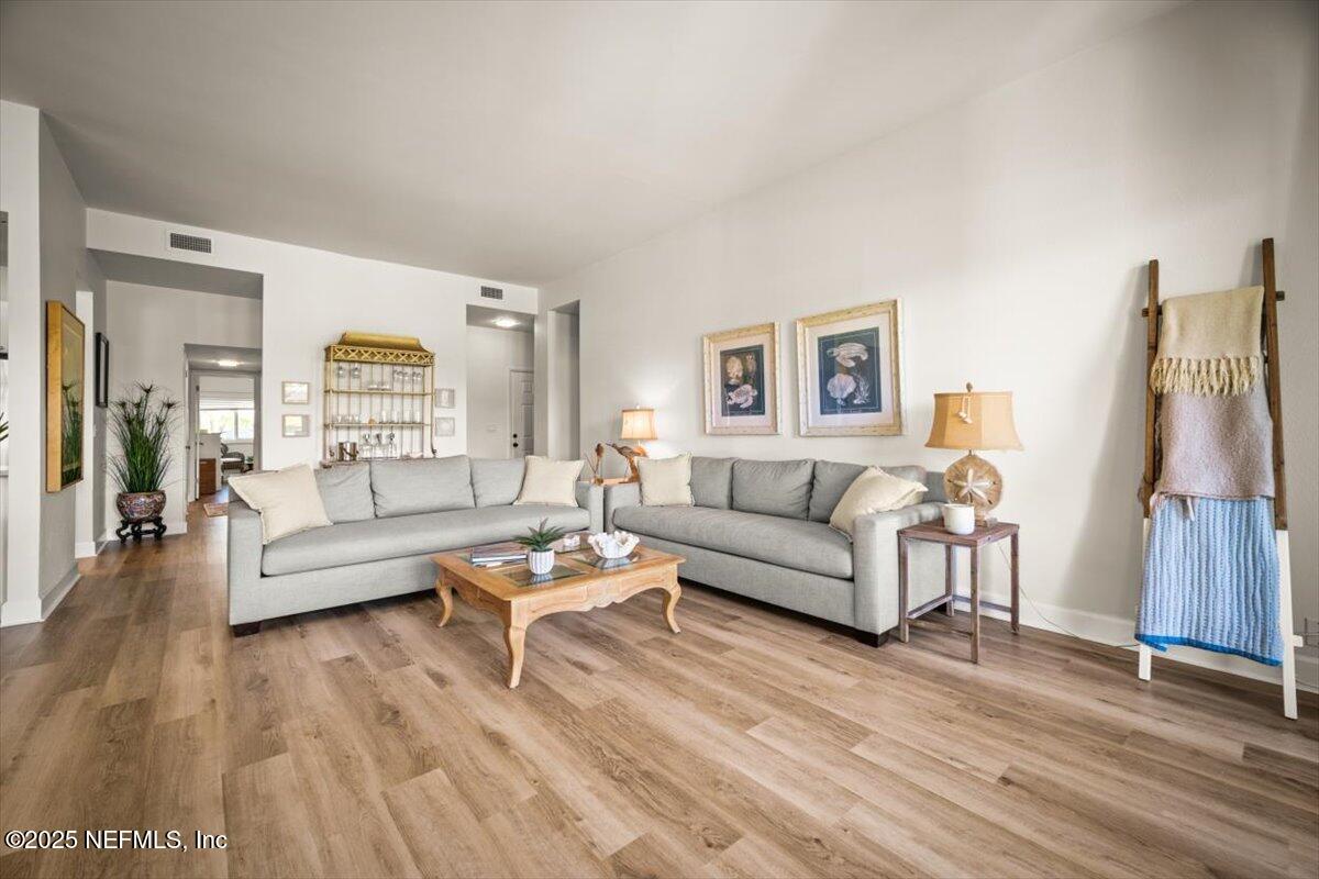 25 Tifton Way South Ponte Vedra Beach, FL 32082 - Photo 2 of 59 a living room with furniture and a wooden floor