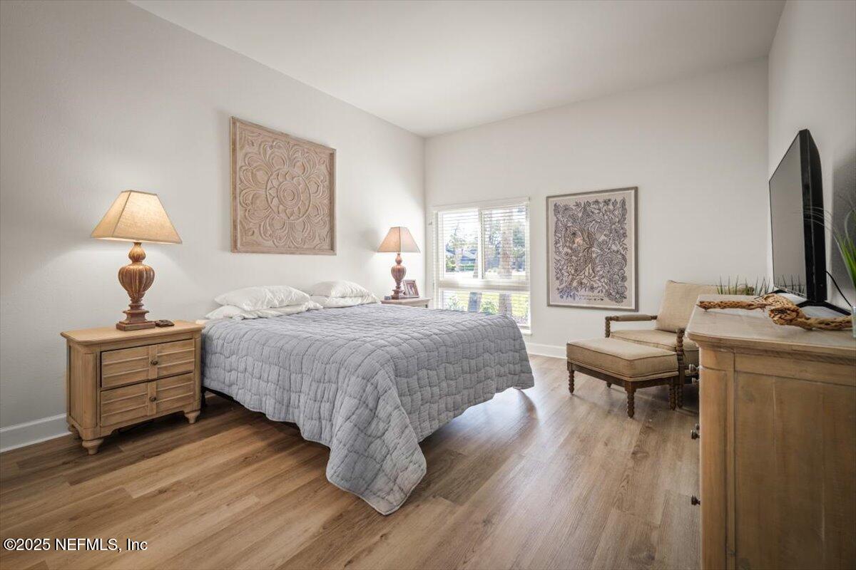 25 Tifton Way South Ponte Vedra Beach, FL 32082 - Photo 24 of 59 a bedroom with a bed and a flat screen tv