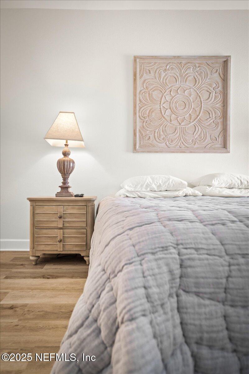 25 Tifton Way South Ponte Vedra Beach, FL 32082 - Photo 26 of 59 a bedroom with a bed and a painting on the wall