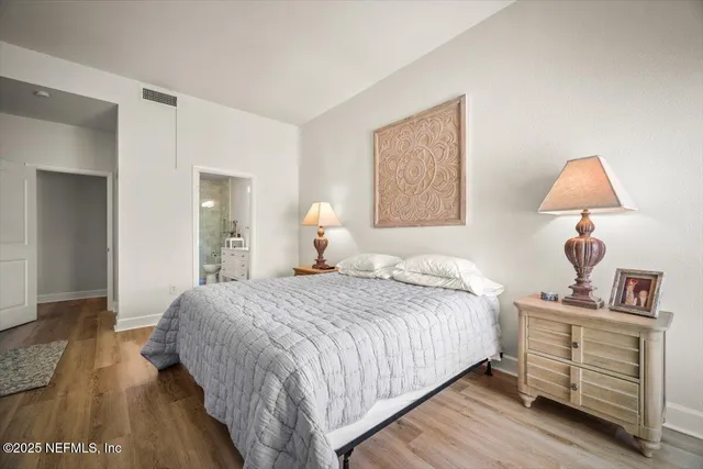 a spacious bathroom with a double vanity sink mirror and double