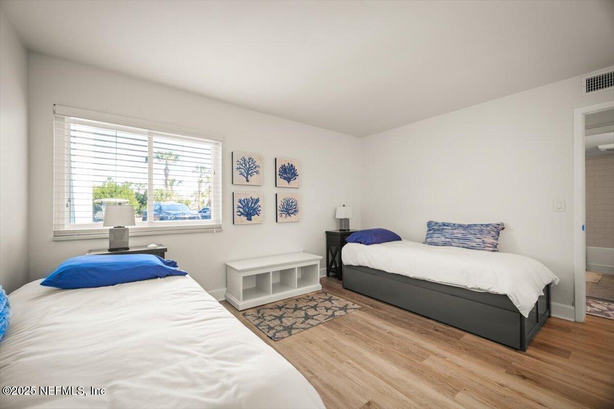 25 Tifton Way South Ponte Vedra Beach, FL 32082 - Photo 35 of 59 a bedroom with a large bed and a window