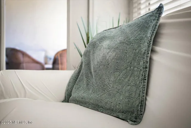 a view of a swimming pool with outdoor seating