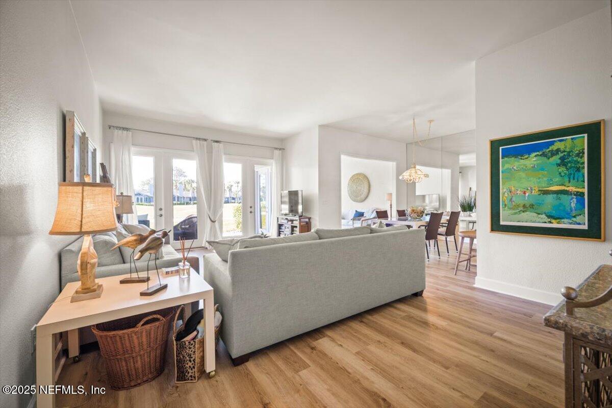25 Tifton Way South Ponte Vedra Beach, FL 32082 - Photo 5 of 59 a living room with furniture and a wooden floor