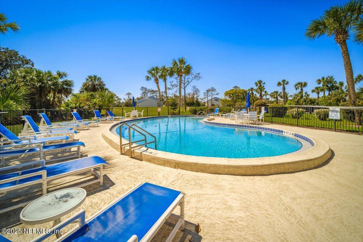 25 Tifton Way South Ponte Vedra Beach, FL 32082 - Photo 51 of 59 a view of a swimming pool with an outdoor seating
