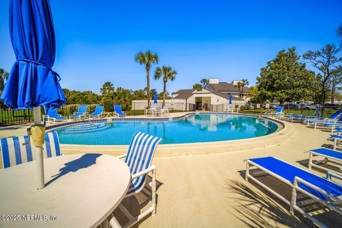 25 Tifton Way South Ponte Vedra Beach, FL 32082 - Photo 52 of 59 a view of a swimming pool with outdoor seating
