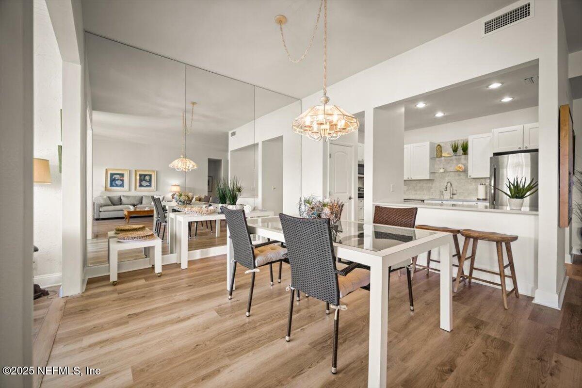 25 Tifton Way South Ponte Vedra Beach, FL 32082 - Photo 10 of 59 a view of a dining room with furniture and wooden floor