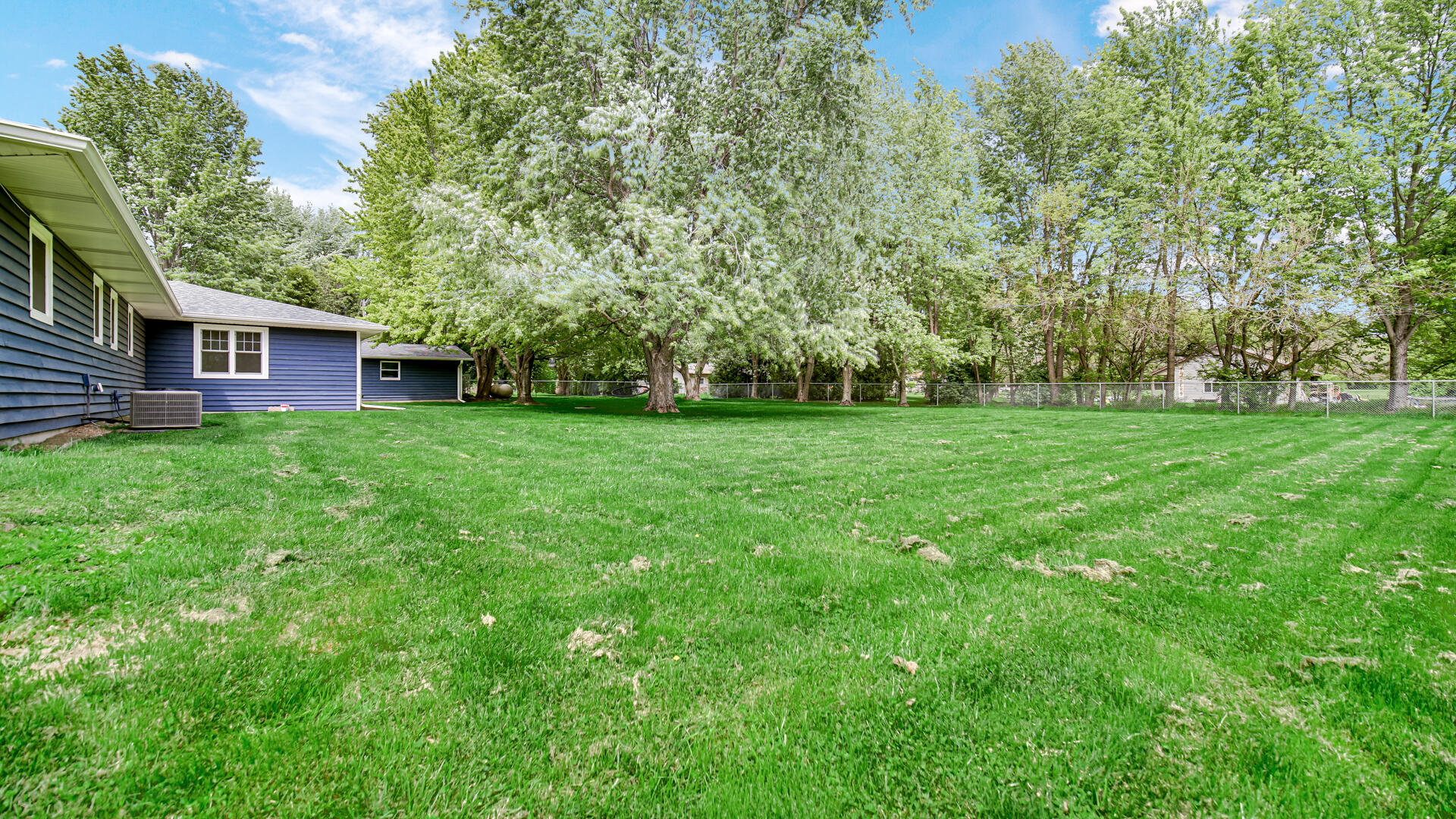 6717 State Rte 49 Rensselaer, IN 47978 - Photo 28 of 31 a view of a tree in a backyard of a house
